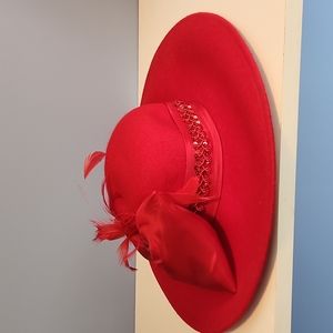 Red wool hat with feather and side bow by KakyCo